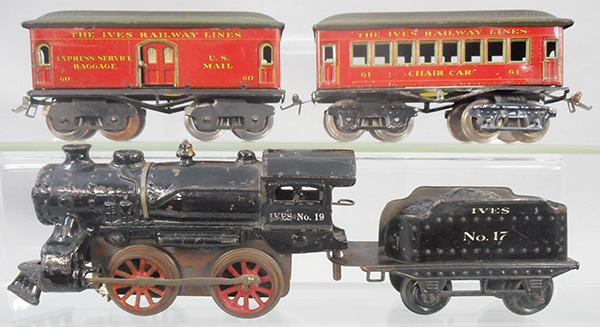 IVES TRAIN SET: O ga, painted cast iron, 19 loco, windup working, motor is stamped 1917, 17 tender, coupler broken, 60 baggage, 61 chair, ca 1917, C6-7.