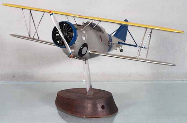 US NAVY BIPLANE: handpainted hardwood, made from Cleveland Model plans from the 40's to 60's, 12" wingspan, w/tail hook, mounted on pylon, good detail, expertly done, C8.
