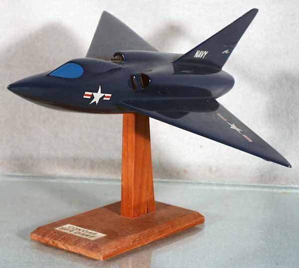 NAVY CONVAIR SEADART JET: handpainted hardwood, made from Cleveland Model plans from the 40's to 60's, 8 1/2" wingspan, 12" long, minor paint chips, mounted on pylon, good detail, expertly done, C7-8.