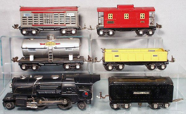 LIONEL TRAIN SET: O ga, 259 loco, 1689W tender, 804 Sunoco tank, both decals have small chips, 652 gondola, 656 cattle car, 657 caboose, set has play wear & scratches, C4-5.