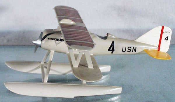 CURTIS CR3 US NAVY RACE BIPLANE W/FLOATS: handpainted hardwood, made from Cleveland Model plans from the 40's to 60's, 8 1/2" wingspan, a few exhaust pipes on left side are broken off, good detail, expertly done, C8-9.