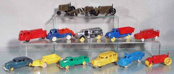14 PLASTIC VEHICLES: most are Banner, Tow Truck missing its tow arm, Gasoline Truck finish worn, a few have tin bottoms, from 3 1/4" to 4 3/4" long, C5-9.