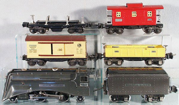LIONEL TRAIN SET: O ga, 265E loco, scratched on cowl & die cast cab, some oxidation spots, 265W tender, whistle removed, oxidation spots on 1 side, dented, 655 box car, missing 1 brakewheel top, 2652 gondola, 3651 dump