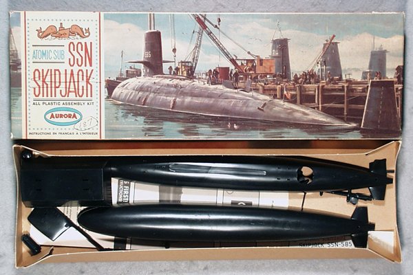 AURORA 711-130 SSN SKIPJACK ATOMIC SUB MODEL KIT: plastic, a few pieces still attached to trees, w/instructions & stickers, some graffiti on instructions, orig box, pen graffiti on top, C8-9.