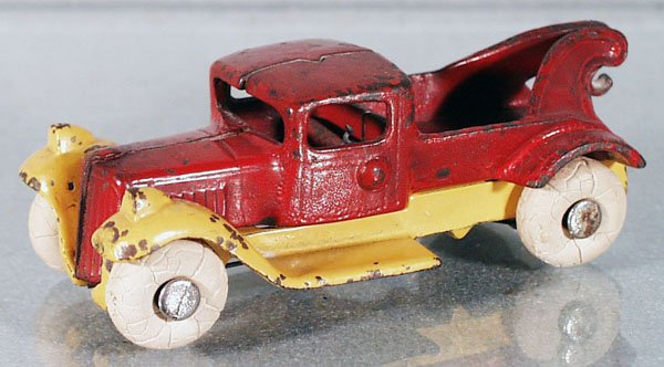 KILGORE WRECKER: painted cast iron, 4 3/4" long, yellow & red, tires worn, C5.