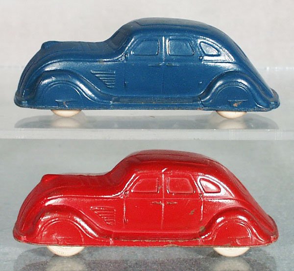 2 SUN RUBBER AUTOS: both 4" long, white rubber tires, some minor paint wear, C6-7.
