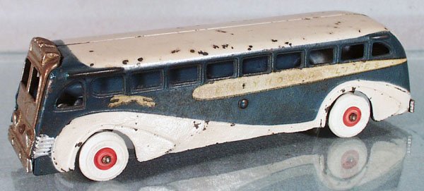 ARCADE GREYHOUND BUS: painted cast iron, nickel grille, replaced rubber tires, 9" long, C5-6.