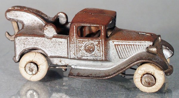 KILGORE GRAHAM WRECKER: painted cast iron, nickel grille, silver, rubber tires worn, 4" long, most of paint worn off roof, C3-4.