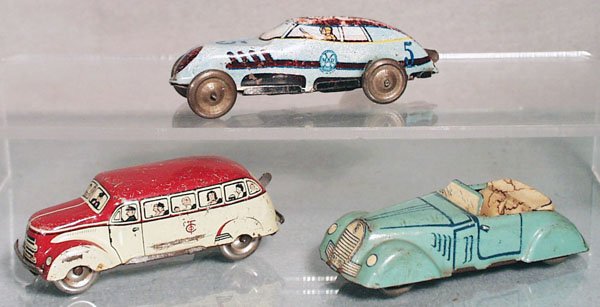 3 TIN VEHICLES: litho tin, Marx #5 Comet Race Car, windup working, 4" long, some playwear, Tipp Co. Bus, windup working, 3 1/2" long, some playwear, Roadster, non-powered, 3 3/4" long, some playwear, C3-4.