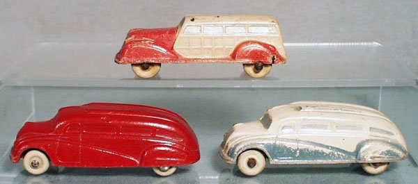 3 SUN RUBBER VEHICLES: 1937 Station Wagon, 3 3/4" long, faded, paint cracking, 2 1936 White Buses, each 4 1/4" long, the 2-tone one has worn paint, C3-5.