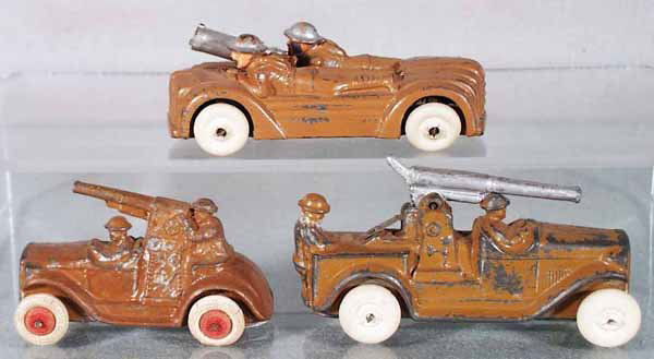 3 BARCLAY ARMY VEHICLES: 2-Man Gun Car, 4" long, AA Gun Truck, 3" long, repainted, AA Truck, 4" long, C4-5.