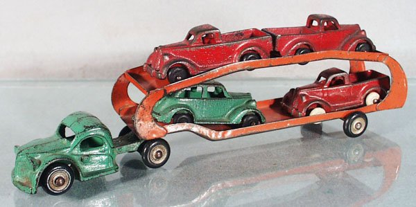 ARCADE AUTO TRANSPORT: painted cast iron, 11 1/4" long, pressed steel trailer, w/3 Packard Pick Ups & a Sedan, 3 3/4" long, C4-5.