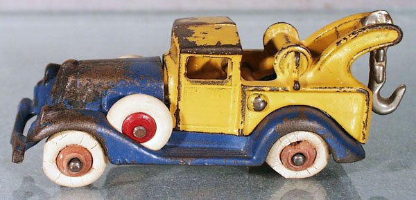HUBLEY DELUXE WRECKER: painted cast iron, blue & yellow, 2 tires worn, 4 3/4" long, C4-5.