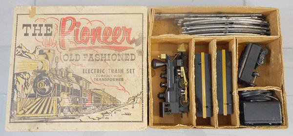 MARX 54732 PIONEER TRAIN SET: O ga, plastic, Wm Crooks loco & tender, rubberstampings worn, w/litho tin baggage & coach, coach has 1 broken chimney, w/track & transformer, orig set box & dividers worn, C7.