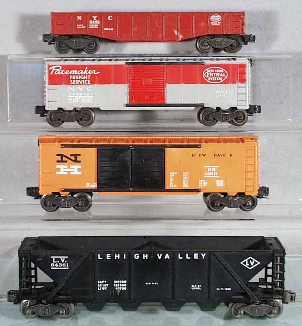 4 LIONEL FREIGHT CARS: O ga, 6462 gondola, w/2 paint spots, 6464-125 Pacemaker box car, 6468-25 New Haven automobile box car, 6436 LV quadhopper, C5-8.