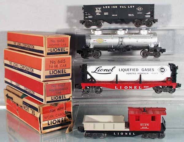 4 LIONEL FREIGHT CARS: O ga, 6456 hopper, 6415 Sunoco tank, chip on catwalk, 6467 miscellaneous car, w/repro tube, 6119 work caboose, orig boxes minor wear, 1 box incom, C6-7.