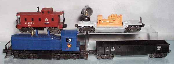 LIONEL TRAIN SET: O ga, 621 Jersey Central NW2 Switcher, 3520 searchlight, missing brakewheel, 6462 NYC gondola, 6457 caboose, C6-7.