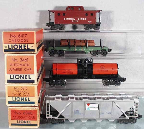 4 LIONEL FREIGHT CARS: O ga, 6417-25 caboose, 3461 automatic lumber car, 6315 chemical tank car, 6346 Alcoa quadhopper, orig boxes minor wear, C6-8.