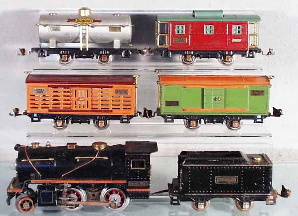 LIONEL TRAIN SET: O ga, 257 loco, rewheeled, handrails replaced, 257T tender, missing coal load, some oxidation spots, 806 stock, 805 box car, 804 Sunoco tank, 807 caboose, C4-6.