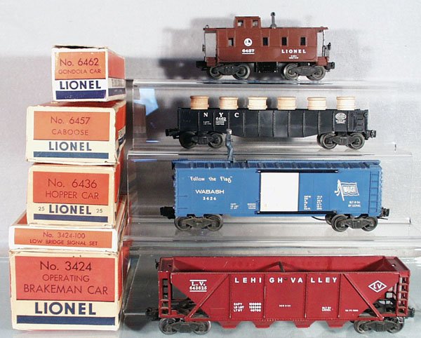 4 LIONEL FREIGHT CARS: O ga, 6462 gondola w/barrels, 6457 caboose, 3424 operating brakeman car w/3424-100 set, 6436-25 LV hopper, orig boxes worn, C5-6.