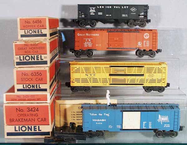 4 LIONEL FREIGHT CARS: O ga, 6456 LV hopper, 6464-25 Great Northern, dent in roof corner, 6356 stock car, 3424 operating brakeman car w/3424-100 peripherals, orig boxes minor wear, C5-7.