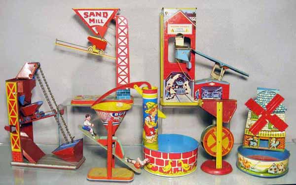 077: 7 SAND TOYS: litho tin, Sand Elevator, Chein Sand Mill, Wolverine Coal Loader, Chein Busy Mike, Ohio Art Well, Sand Mill, T.Cohn Windmill, C5-8.