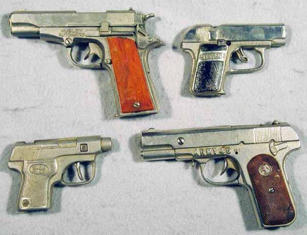 092: 4 TOY AUTOMATIC CAP GUNS: Hubley Army 45, 6" long, Stevens 25-50, 4 1/4" long, Kenton Sure Shot, 4 1/4" long, Hubley Automatic, die cast, 6 1/2" long, C5-7.