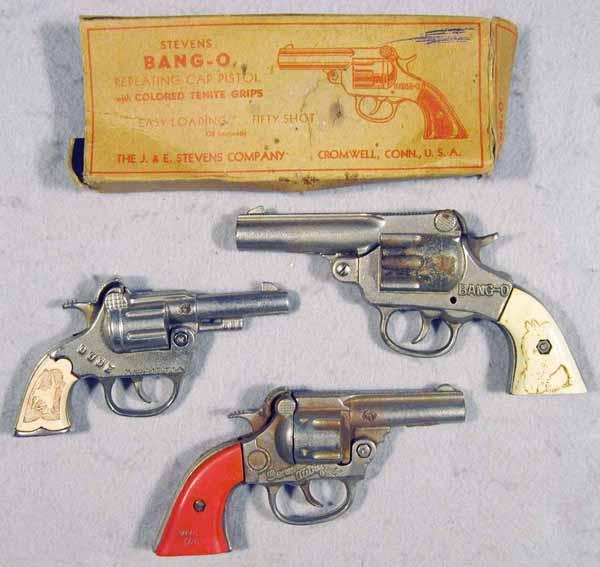 096: 3 TOY WESTERN CAP GUNS: cast iron w/plastic grips, Stevens Bang-O, orig box worn, Kenton Dude, 6" long, Kenton Gene Autry, 6 1/2" long, C5-6.