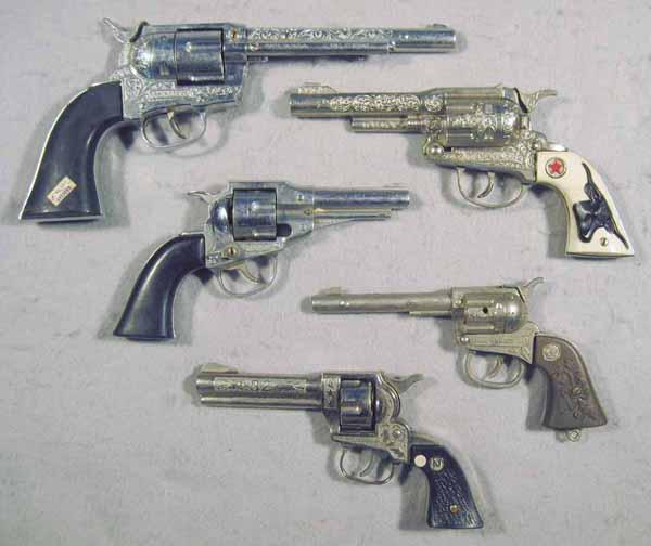 5 WESTERN REVOLVER TOY CAP GUNS: die cast, Hubley, 12" long, grip cracked, Texan Jr., 9 1/2" long, Hubley, 8" long, Lone Ranger .32, 8" long, Nichols Stallion, 8" long, all are working, C5-8.