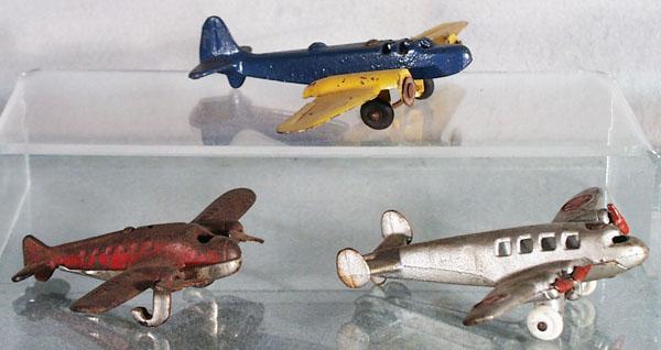 3 CAST IRON AIRPLANES: Arcade Bomber, litho tin wings, missing propellers, Arcade Airliner, missing tires & axles, Hubley Airliner, 5" to 7" wingspans, C2-5.