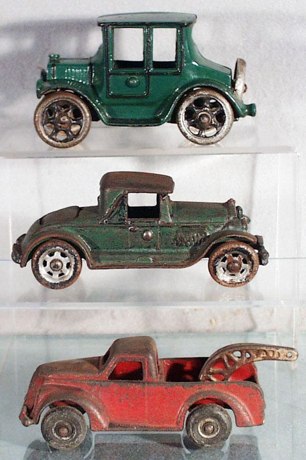 3 CAST IRON AUTOS: Grey Iron Model T, 5 1/2" long, repainted, AC Williams Rumbleseat Coupe, 6" long, Arcade Wrecker, 5 1/2" long, C3-5.