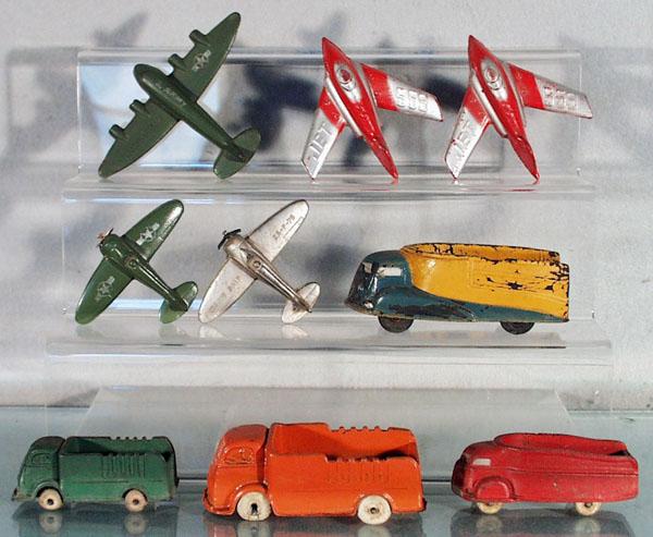 9 RUBBER VEHICLES: 3 Sun Rubber airplanes, 1 missing propellers, 4" to 6" wingspan, 2 Auburn Rubber Jets, 4" wingspans, 2 Sun Rubber & 2 Auburn Rubber Trucks, 4" to 5 1/2" long, playworn, C4-6.