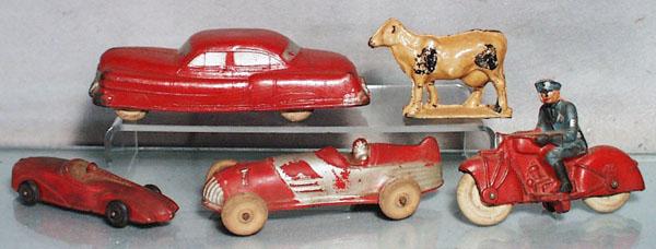 5 AUBURN RUBBER TOYS: Cadillac, 7 1/4" long, Cow, 3 1/2" long, Racer, 5" long, Racer, 6 1/4" long, Motorcycle Cop, 5" long, all have some warping, C4-5.