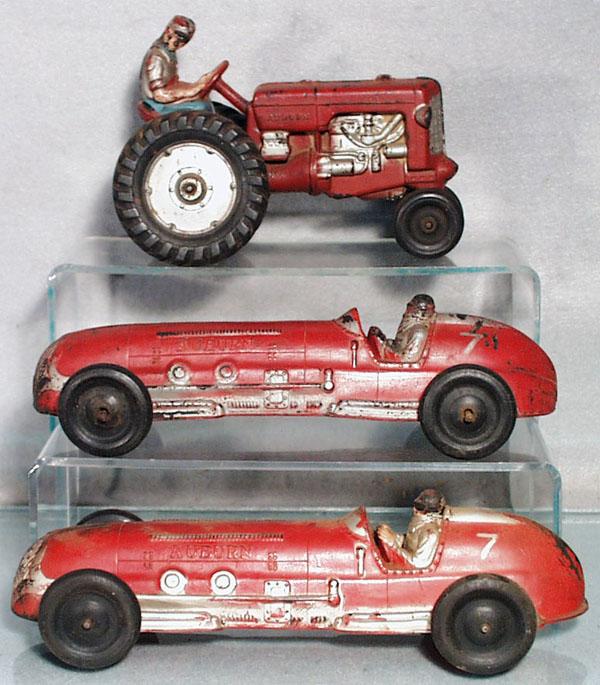 3 AUBURN RUBBER TOYS: Tractor, 7" long, Indy Racer, 10" long, Indy Racer, 10 1/2" long, playworn, C4-5.