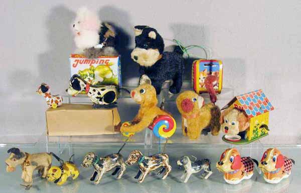 13 DOG TOYS: Japan, litho tin & plush, 12 are windups working, 1 is battery operated, 1 orig box only, C5-9.