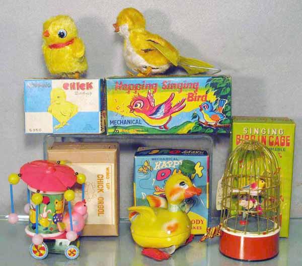 5 BIRD TOYS: litho tin, plastic & plush, all are windups working, Hopping Chick, Hopping Singing Bird, Chick Orgol, celluloid chassis chipped, Happy Duck, Singing Bird in Cage, orig boxes, C7-9.