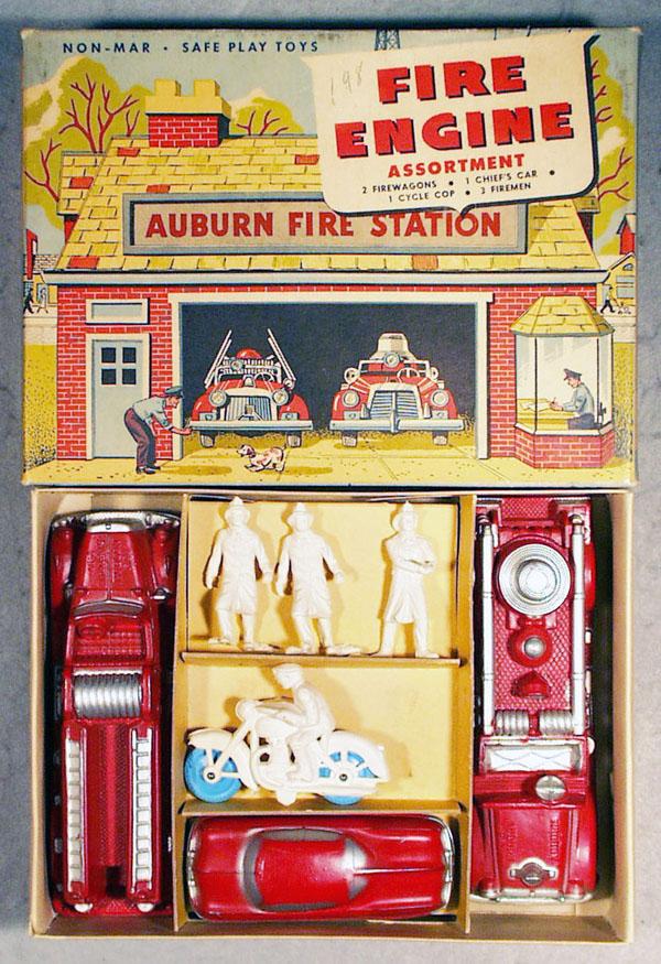 AUBURN RUBBER 523 FIRE ENGINE ASSORTMENT SET: 4 vehicles & 3 firemen, fire trucks are 7 1/2" long, figures are 3" tall, orig set box & insert, C7-9.