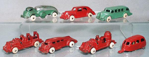 6 HUBLEY VEHICLES: painted cast iron, tank truck, 3 3/4" long, sedan w/trailer, 6 1/2" long, bus, 3 1/4" long, ladder truck, 3 1/2" long, futuristic bus, 3 1/2" long, fire pumper, 3 1/2" long, C4-6.
