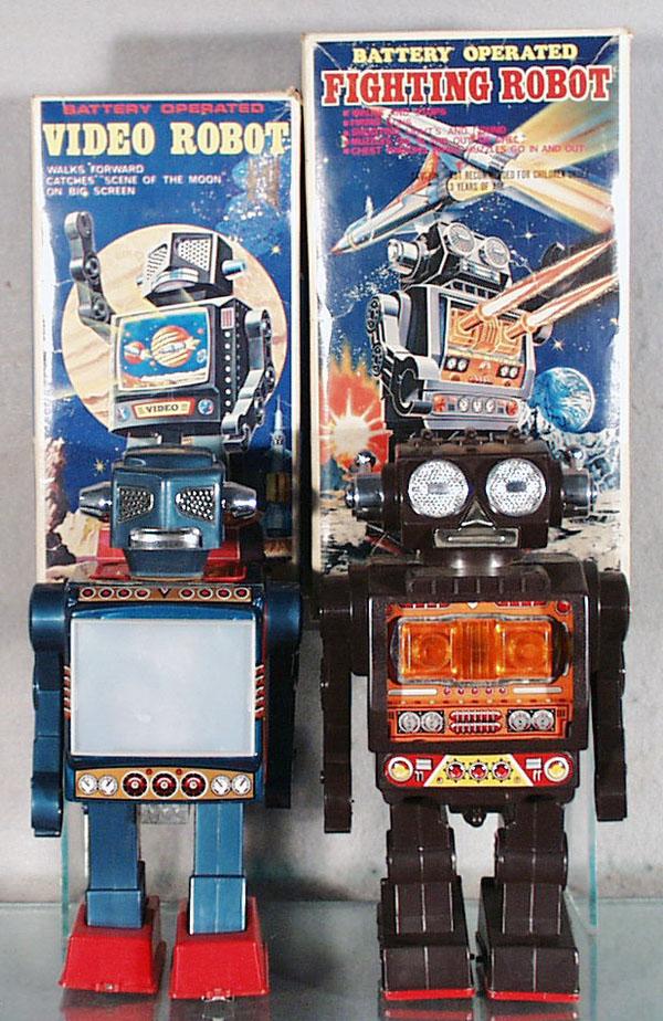 2 SH of JAPAN ROBOTS: plastic, battery operated, Video Robot, 9 1/2" tall, working, Fighting Robot, 9 3/4" tall, not working, orig boxes minor wear, C7-8.