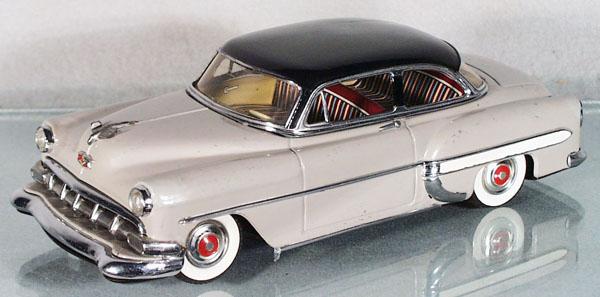MARUSAN 1954 CHEVROLET SEDAN: litho tin, friction not working, black rubber tires, 11" long, some touch up, playwear, C5-6.
