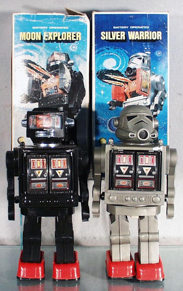 2 TOY ROBOTS: Hong Kong, Moon Explorer, Silver Warrior, plastic, battery operated, not working, battery boxes clean, both 11 1/4" tall, orig boxes, 1 rough, C7-8.