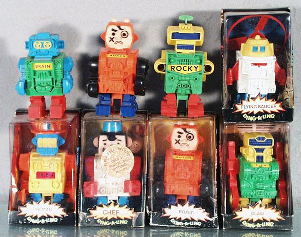 8 DING-A-LING ROBOTS: plastic, battery operated, 4 1/2" to 5 1/2" tall, 5 orig boxes only, 1 box taped, C7-9.