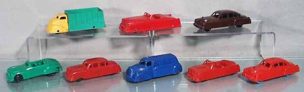 8 TOY VEHICLES: plastic, box truck, 4 3/4" long, convertible, 5" long, missing rear wheel set, glue residue underneath, 2 Cadillacs, Buick convertible, Ford sedan, Tank Truck, Ford convertible, C6-9.