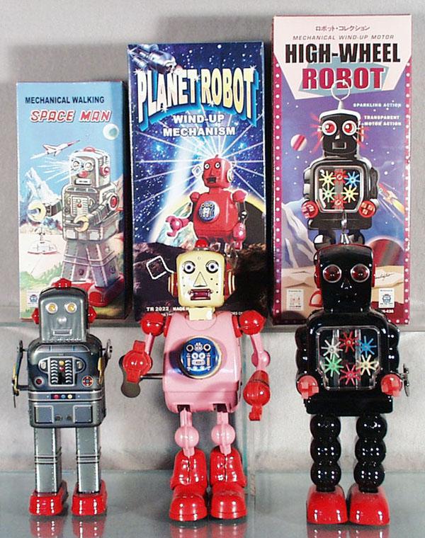 3 CONTEMPORARY ROBOTS: China, litho tin, windups working, Spaceman, 7 3/4" tall, Planet Robot, 9" tall, High Wheel Robot, 10" tall, orig boxes, C9.
