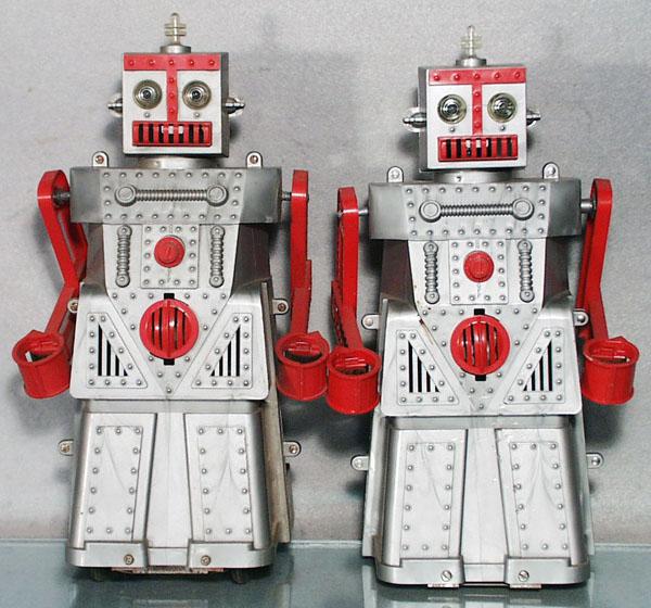 2 IDEAL ROBERT THE ROBOTS: plastic, 1st versions, mising die cast tools, remote controllers, both have broken arm joints, C7-8.
