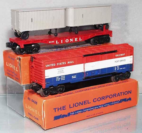 2 LIONEL FREIGHT CARS: O ga, 6440 flat car w/piggyback vans, 6428 mail car, orig boxes, 1 missing perforation insert, C7-8.