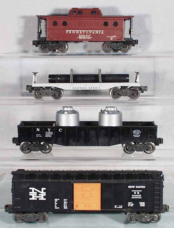 4 LIONEL FREIGHT CARS: O ga, 6417 New York Zone caboose, 6411 flat w/pipes, 6462 NYC gondola, w/2 MPC canisters, 6464-425 New Haven box car, C5-7.