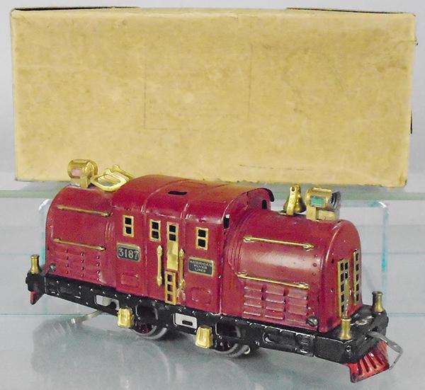 AMERICAN FLYER 3187 LOCO: O ga, maroon, paint is alligatoring, 1 headlight fatigued, 1 small touch up spot on each side of loco, orig box worn, C7.