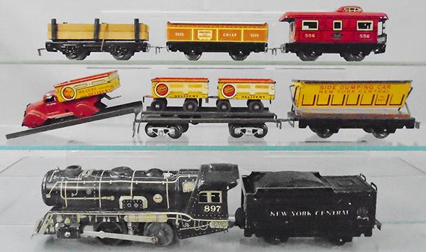MARX TRAIN SET: O ga, litho tin, 897 loco, 951 NYC tender, 561 NYC dump, green unloading car w/ramp, Deluxe truck w/2 trailers, 563 lumber flat, 552G gondola, 556 caboose, w/tunnel, tell tale, wood crossing, accessor