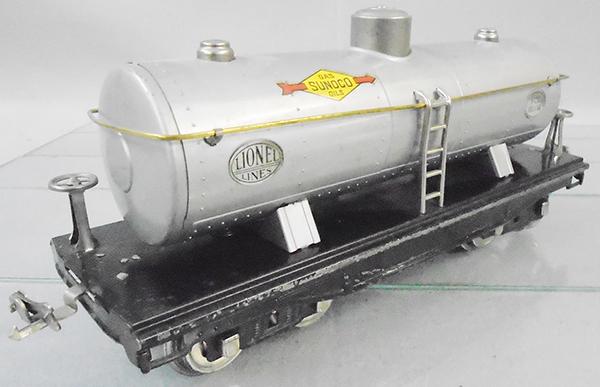 LIONEL 215 SUNOCO TANK CAR: std ga, silver, nickel trim w/brass handrail, paint wear to edge of chassis, orig box has no number stamped on, minor wear, C6-7.